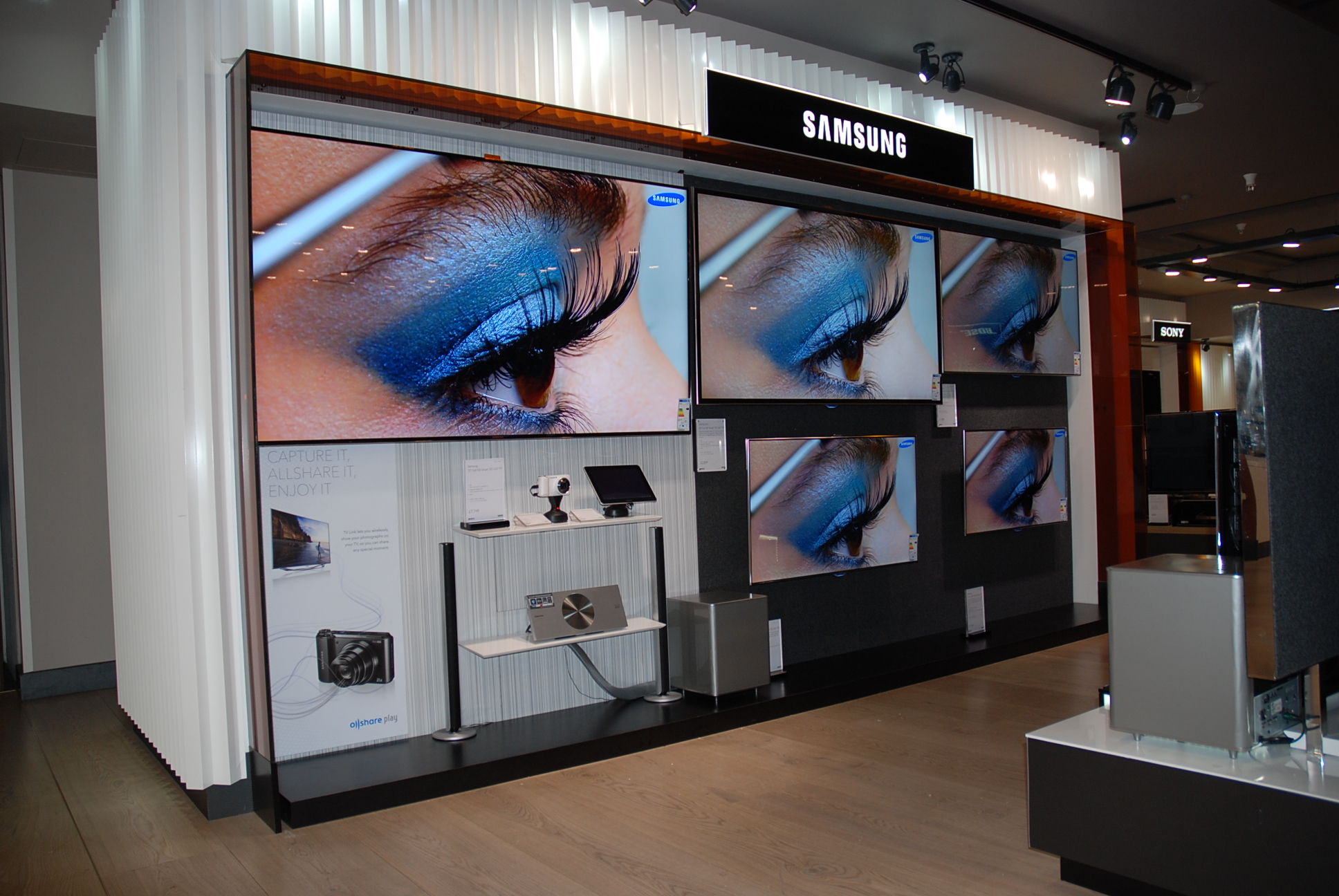 Samsung shop-in-shop display at Harrods London with TV wall and devices